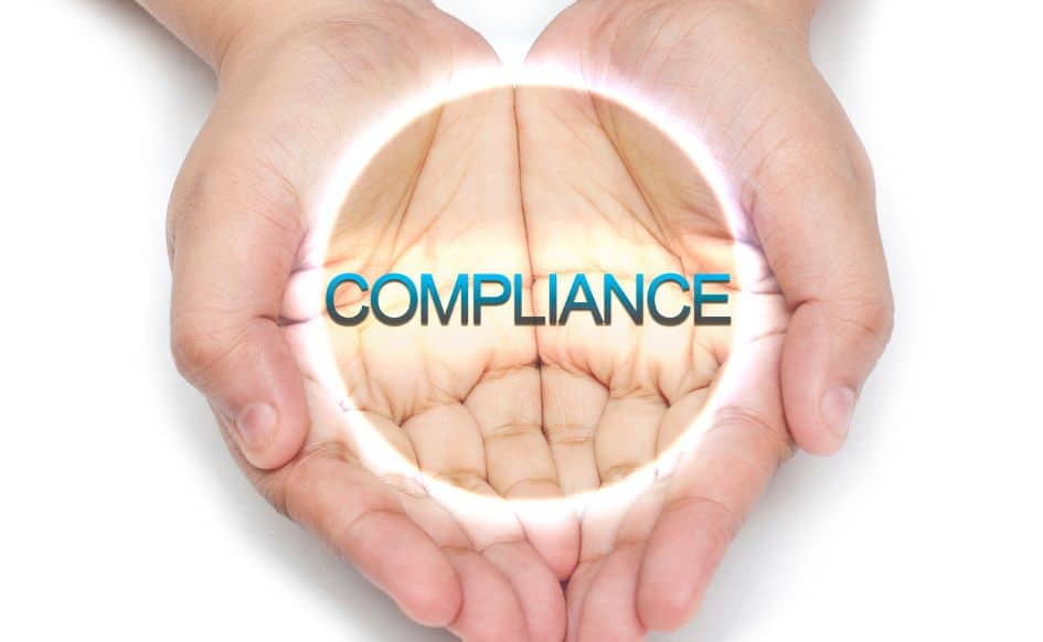 two hands clasped with "COMPLIANCE" written above them